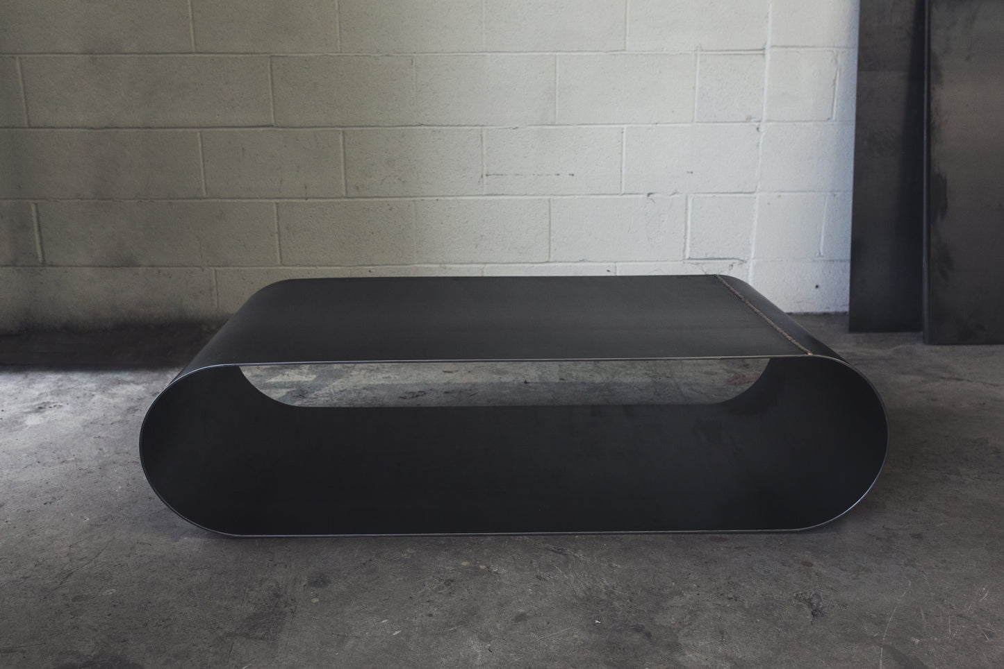 Jouir Coffee Table in Raw Black Steel by MTHARU