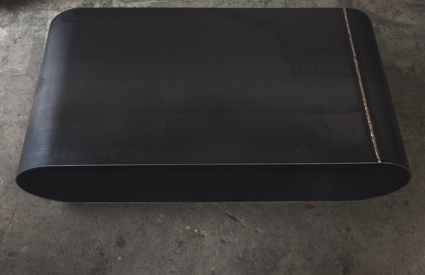 Jouir Coffee Table in Raw Black Steel by MTHARU